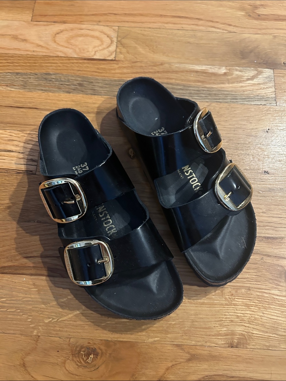 Black Birkenstock Triple-Buckle Slide Sandals with Gold Buckles - Shiny Finish - Picture 1 of 4